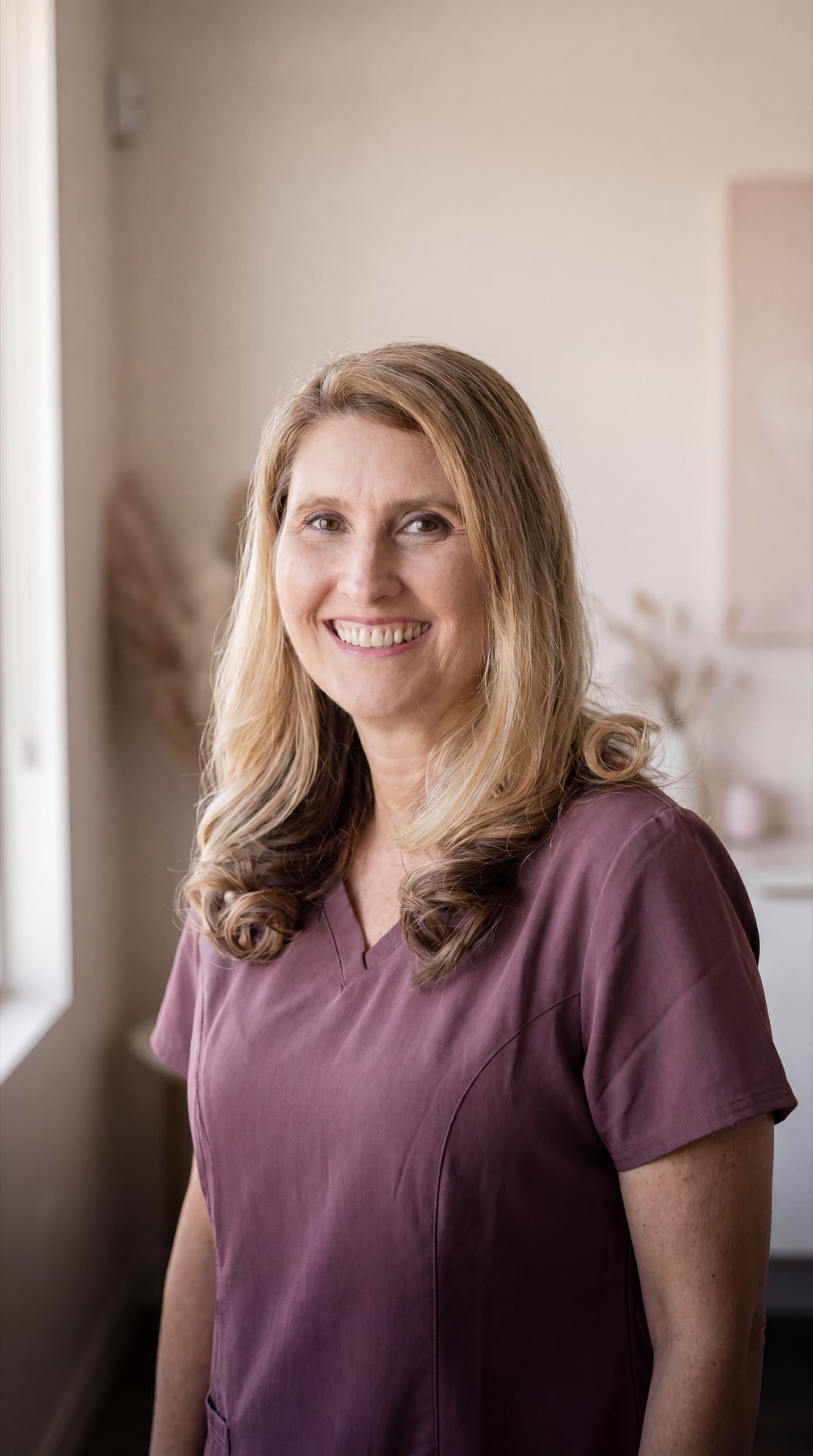 Lisa Moore, GDC-registered dental hygienist and aesthetics practitioner, in her Colchester clinic